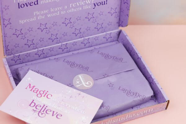 Gift wrapped in illustrated box & branded tissue paper and sticker - Image 2