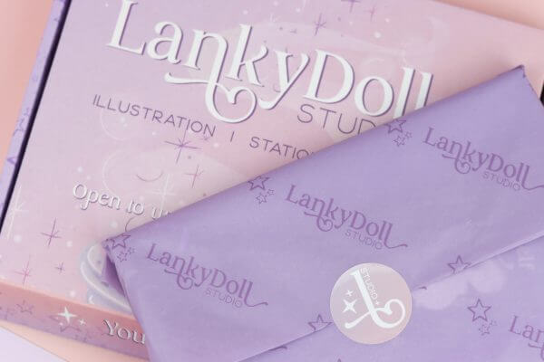 Gift wrapped in illustrated box & branded tissue paper and sticker - Image 3